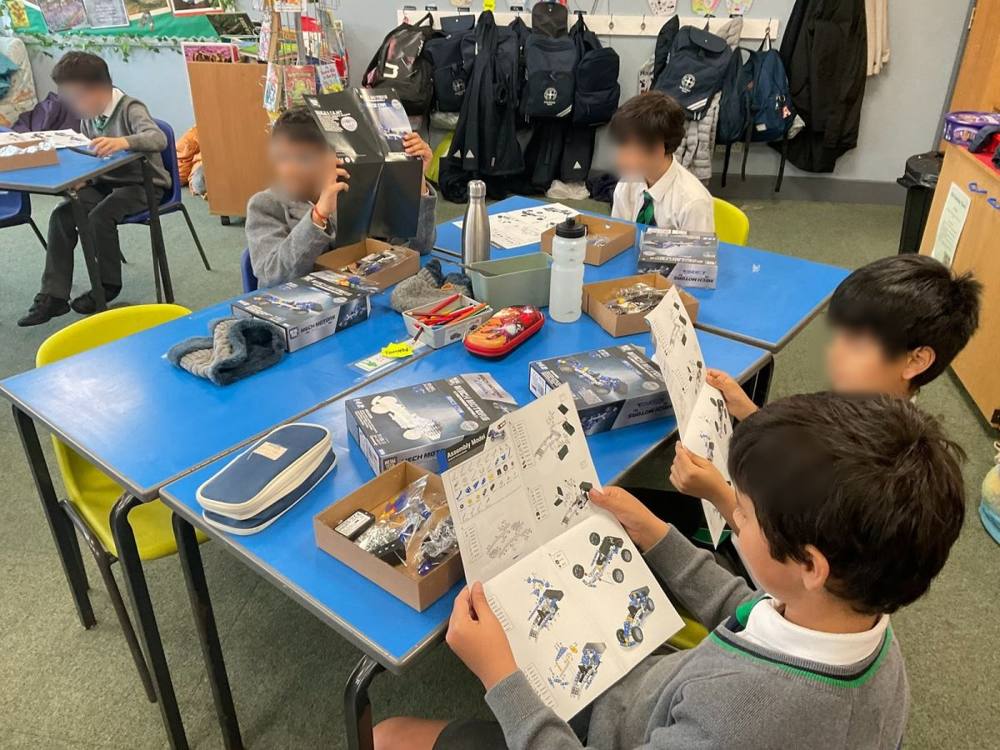 A pupil studying the assembly instructions